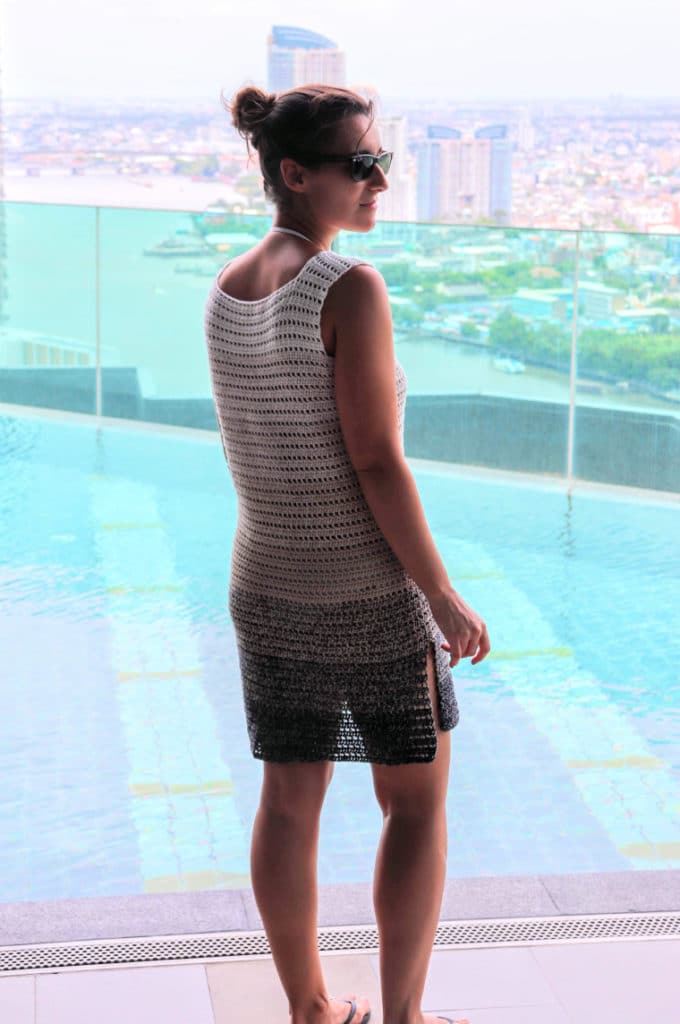 Susana from Fluffy Stitches modeling the Crochet Breezy Beach Dress. View of back