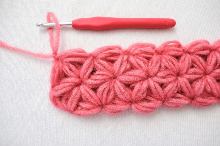 A row of pink jasmine stitches