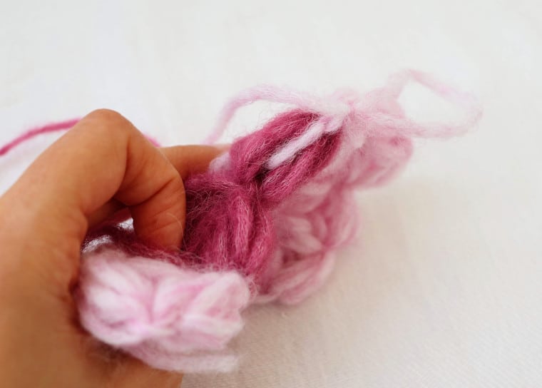 The main color yarn comes from inside the puff stitch