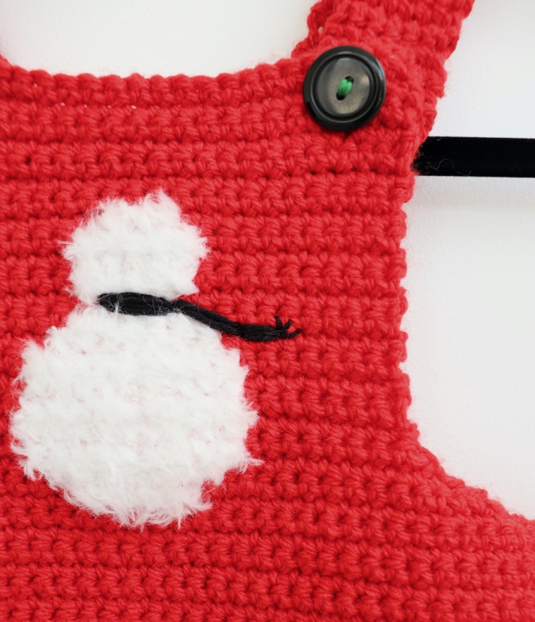Detail of the snowman on the Christmas Baby Overalls.