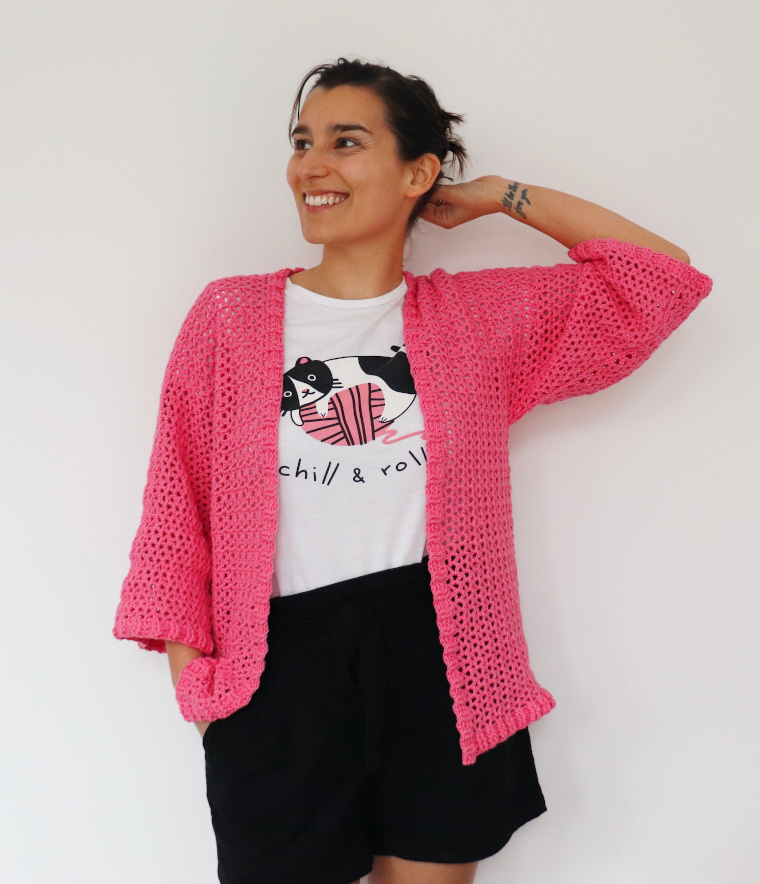 Woman wearing the Crochet Easy Ribbed Cardigan in Bubblegum Pink
