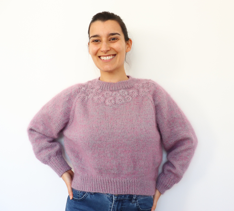 Woman laughing while wearing the Knit Grinalda Sweater by Rosa Pomar