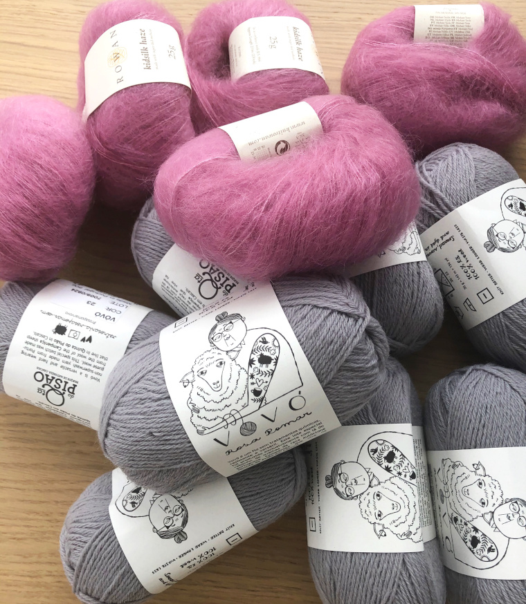 Skeins of Vovo yarn in grey and Kidsilk Haze yarn in pink